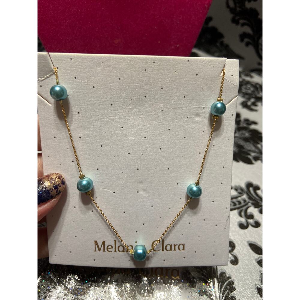 Melania Clara gold with light blue beads necklace